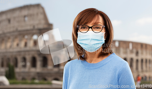 Image of senior woman in protective medical mask in italy