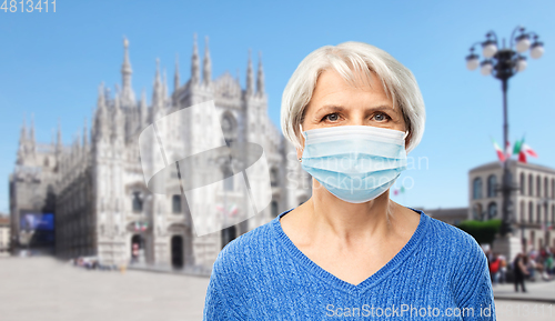 Image of senior woman in protective medical mask in italy