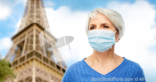 Image of senior woman in protective medical mask in france