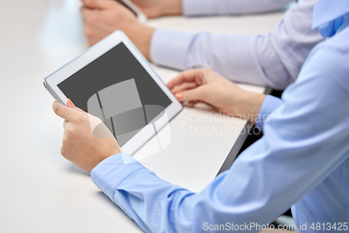 Image of close up of businesswoman with tablet pc at office