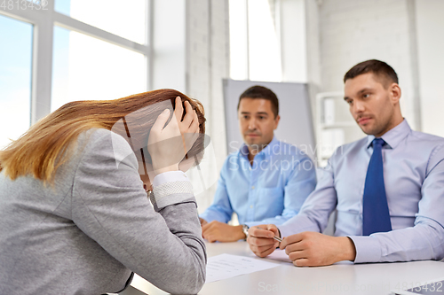 Image of desperate woman on job interview at office