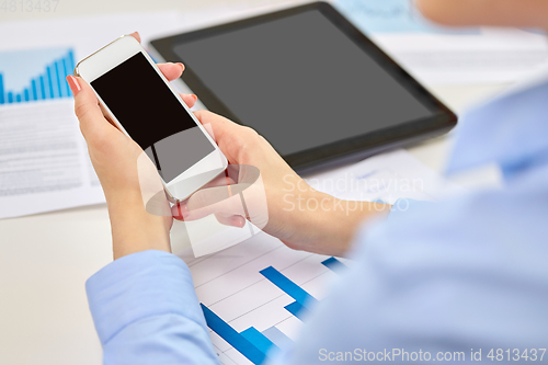 Image of close up of woman with smartphone at office