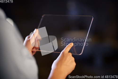 Image of hands with transparent tablet pc computer