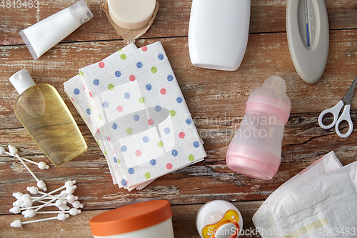 Image of baby accessories for bathing on wooden table