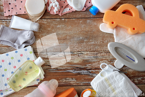 Image of baby accessories for bathing on wooden table