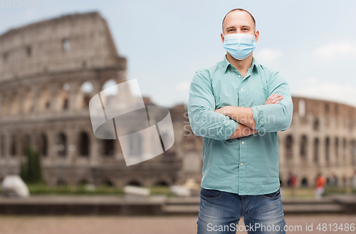 Image of man wearing protective medical mask in italy