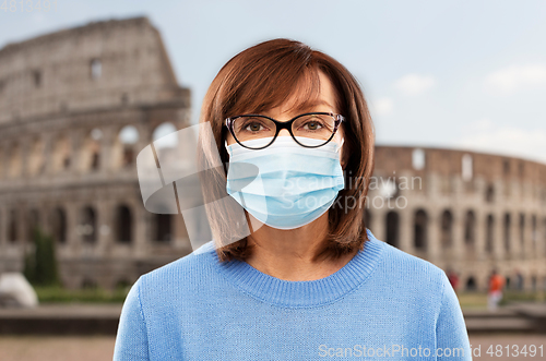 Image of senior woman in protective medical mask in italy