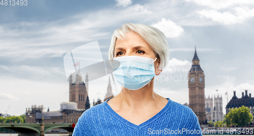 Image of senior woman in protective medical mask in england