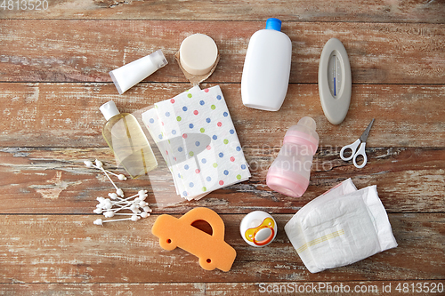 Image of baby accessories for bathing on wooden table