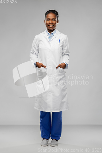 Image of happy african american female doctor or scientist