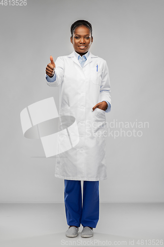 Image of african american female doctor showing thumbs up