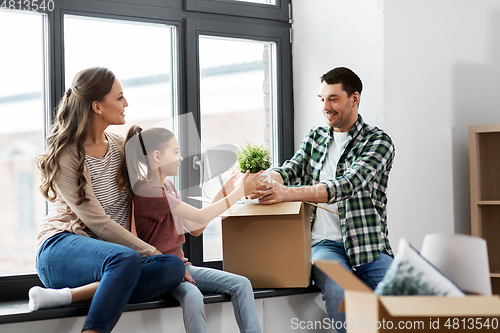 Image of happy family with child moving to new home