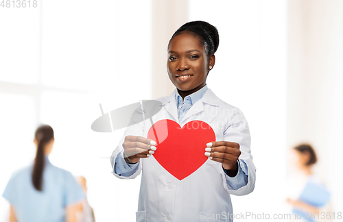 Image of african american female doctor with red heart