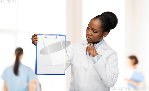 Image of african american female doctor with clipboard