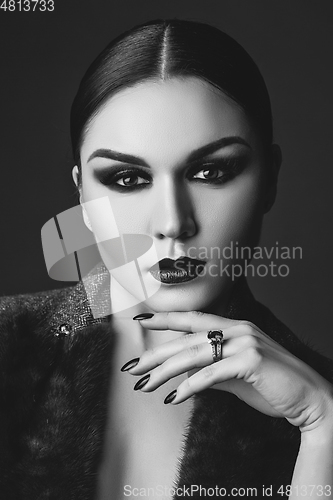 Image of beautiful young woman with dark makeup