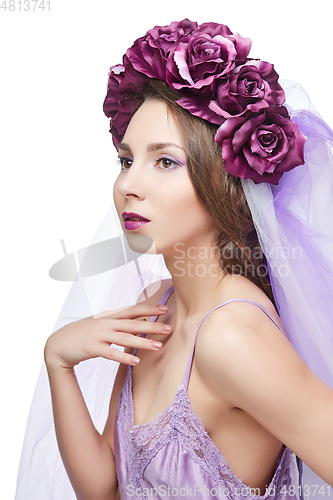 Image of beautiful girl with purple makeup and flowers