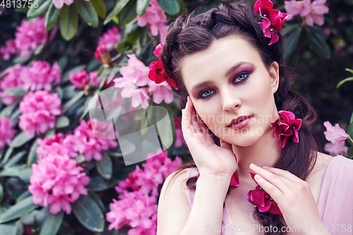 Image of girl in dress in rhododendron garden