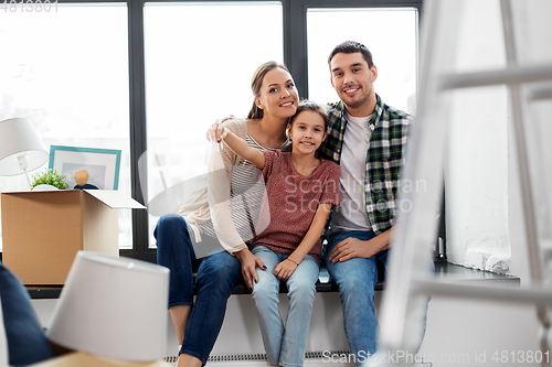 Image of happy family with house keys moving to new home