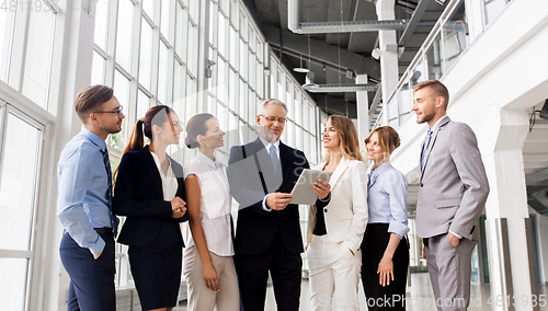 Image of business people with tablet pc computer at office
