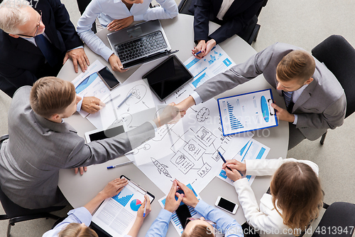 Image of businessmen making handshake at office