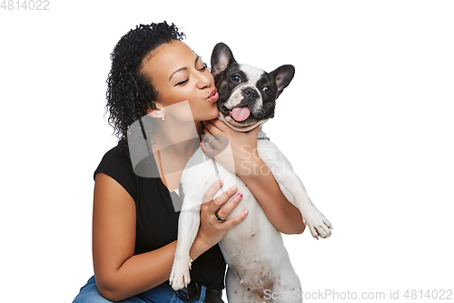 Image of young woman with french bulldog dog