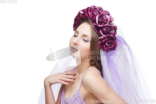 Image of beautiful girl with purple makeup and flowers