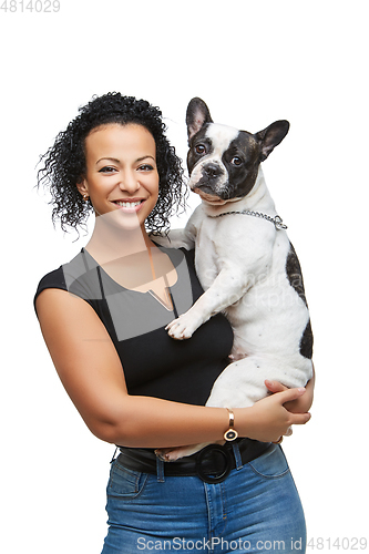 Image of young woman with french bulldog dog