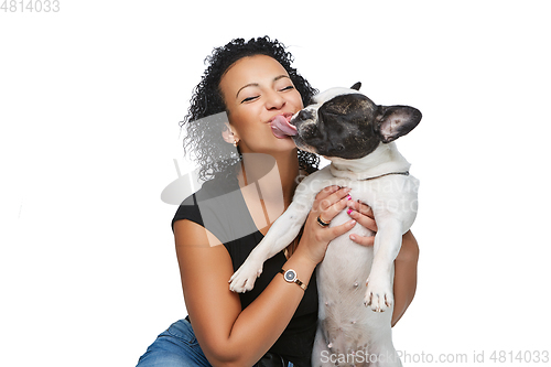 Image of young woman with french bulldog dog