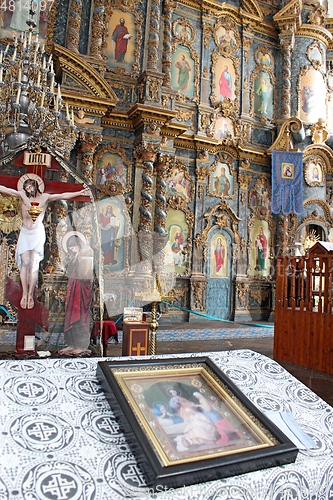 Image of icon by beautiful iconostasis in church