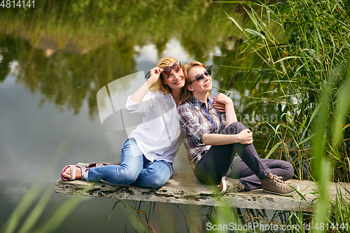 Image of three girls having fun outdoors