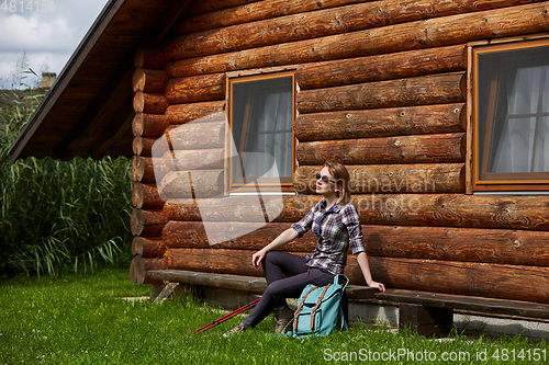 Image of young woman with nordic walk pols