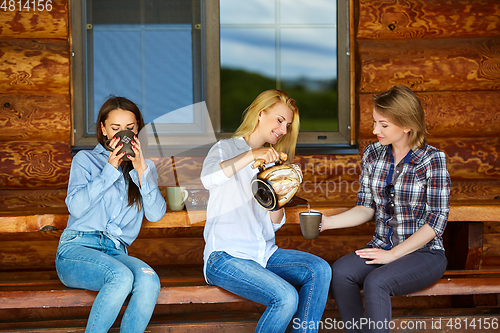 Image of young women drinking tea