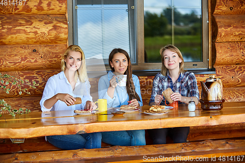 Image of young women drinking tea