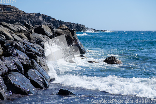 Image of beautiful wild beach with black sand