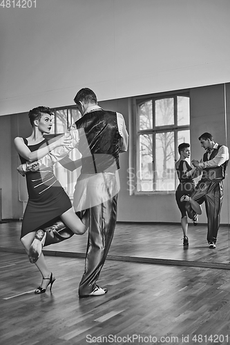 Image of beautiful couple dancing tango