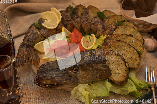 Image of Stuffed pike with vegetables and greens.