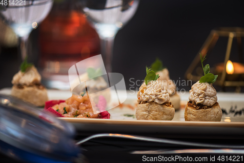 Image of Kegs with salmon fish and cream sauce