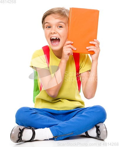 Image of Portrait of a cute little schoolgirl with backpack