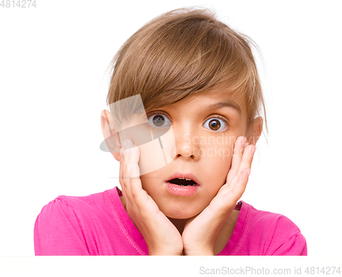 Image of Little girl is looking out from the blank banner