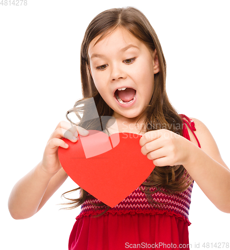 Image of Portrait of a sad little girl in red