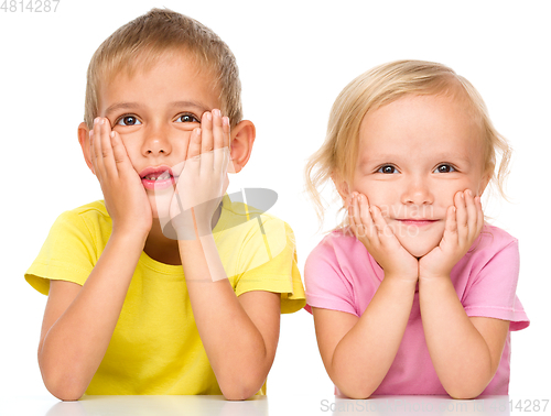 Image of Portrait of a cute little girl and boy