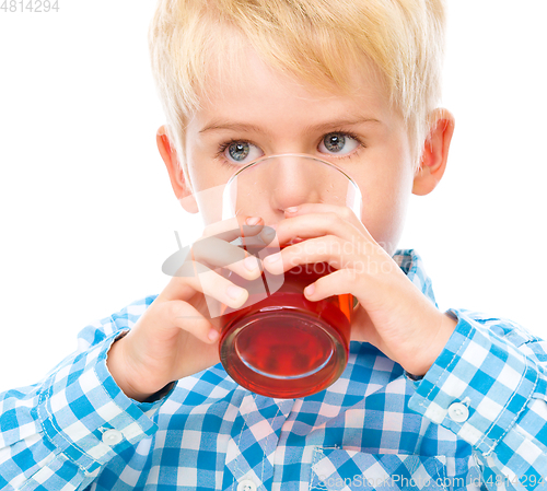 Image of Little boy with glass of cherry juice