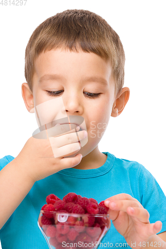 Image of Little boy with raspberries