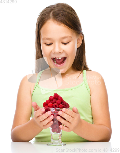 Image of Little girl with raspberries
