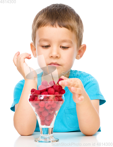 Image of Little boy with raspberries