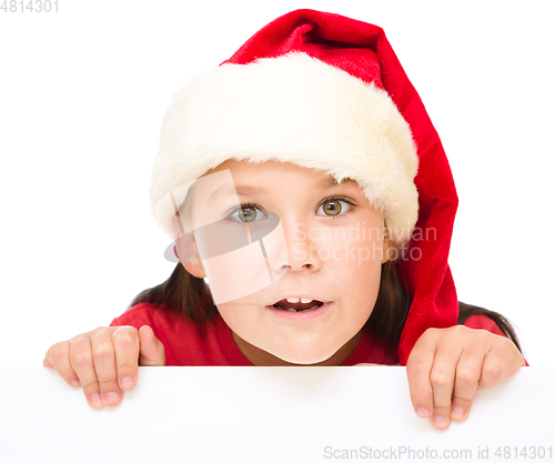 Image of Little girl is holding blank board