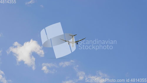 Image of Commercial passenger airplane flying overhead on sunny day. UltraHD stock footage