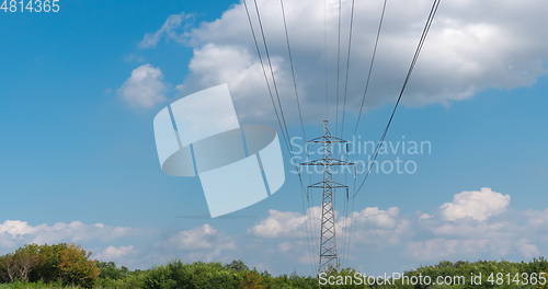 Image of cloudy morning sky and a high-voltage line