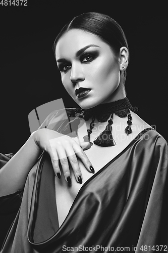 Image of beautiful young woman with dark makeup