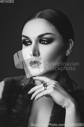 Image of beautiful young woman with dark makeup